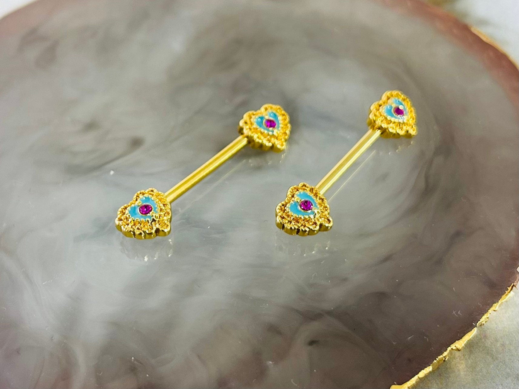 A set of Filigree Heart Nipple Barbell